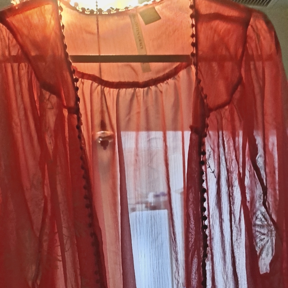 A woman's elegant cover. Name brand forgotten Grace,color of orange.